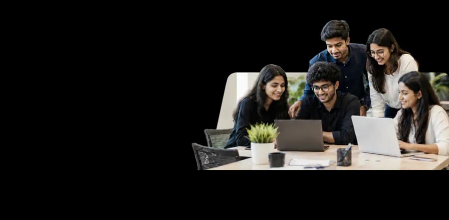 Mekark interns collaborating around laptops