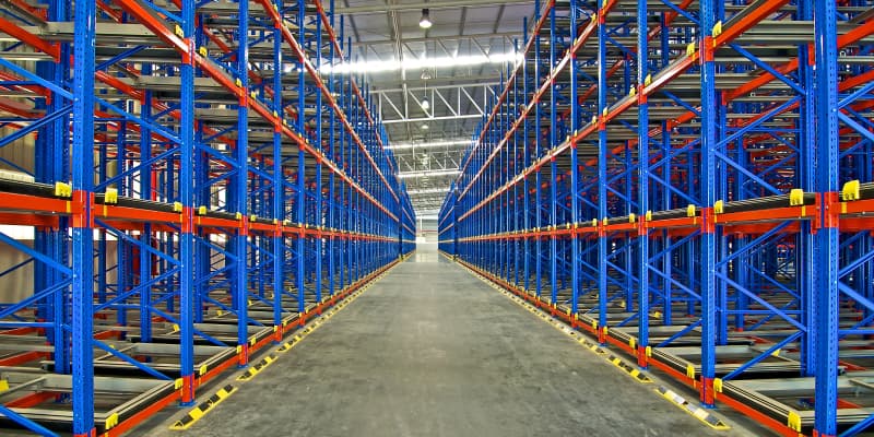 Heavy-duty industrial pallet racking in a warehouse aisle