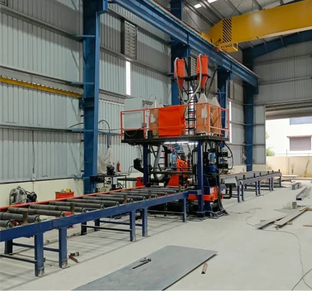 Automated welding machine fabricating steel sections inside the factory
